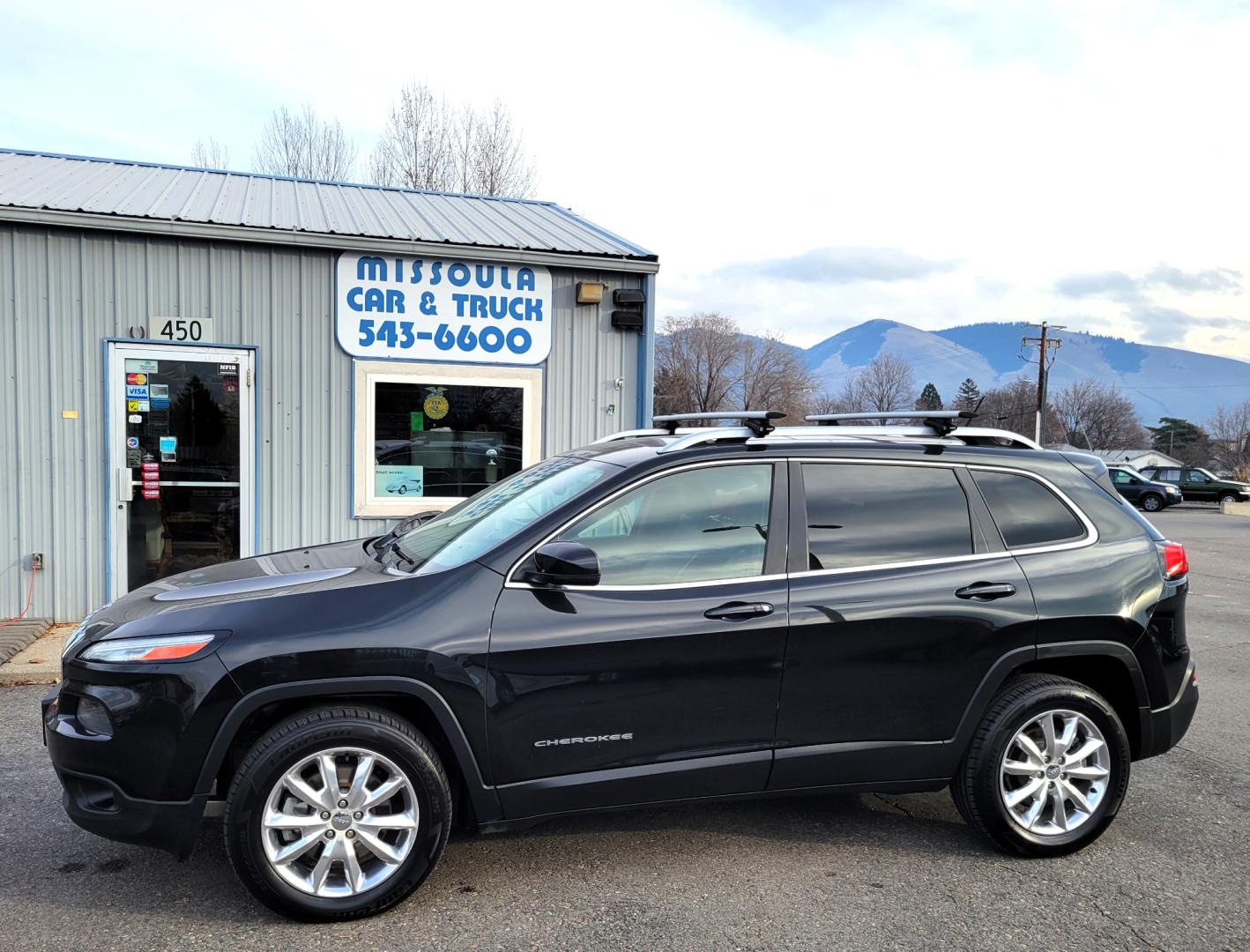 2015 Black /Black Jeep Cherokee Limited (1C4PJMDS4FW) with an 3.2L V6 engine, Automatic transmission, located at 450 N Russell, Missoula, MT, 59801, (406) 543-6600, 46.874496, -114.017433 - Nice Jeep. Lots of Features. 4 Wheel Drive. Automatic. Huge Sunroof. Leather Heated Seats. Power Drivers Seat. Heated Steering Wheel. Bluetooth. Steering Wheel Controls. Air. Cruise. Tilt. Power Windows and Locks. Towing. - Photo#0